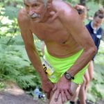 Sewards Fred Moore starts up the mountain on the way to completing his 50th straight Mount Marathon Race on Thursday, July 4, 2019, in Seward, Alaska. (Photo by Jeff Helminiak/Peninsula Clarion)