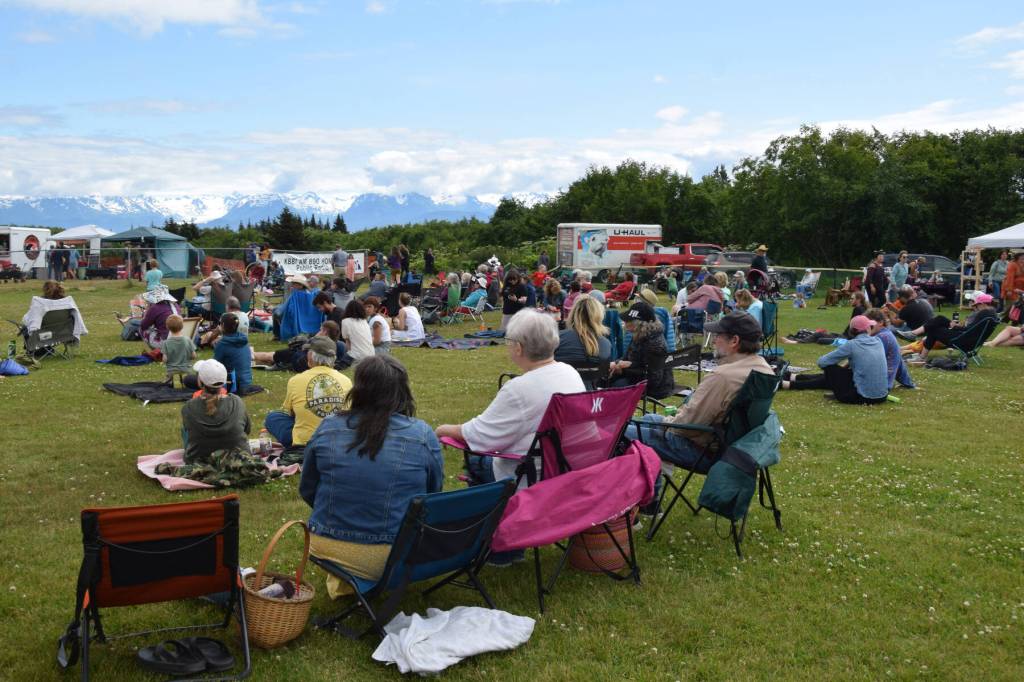 Concert on the Lawn attendees spread out on blankets and in camp chairs on Saturday, July 12, 2025, at Karen Hornaday Park in Homer, Alaska. (Delcenia Cosman/Homer News)