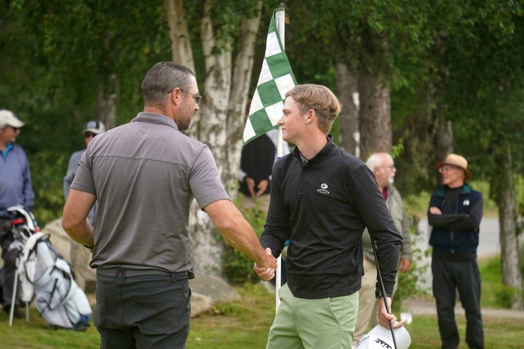 Zac Cowan and Shane Sundberg celebrate after claiming a skin during the Alaska Sign Source Pro Am at Birch Ridge Golf Course in Soldotna, Alaska, on Monday, July 14, 2025. (Jake Dye/Peninsula Clarion)