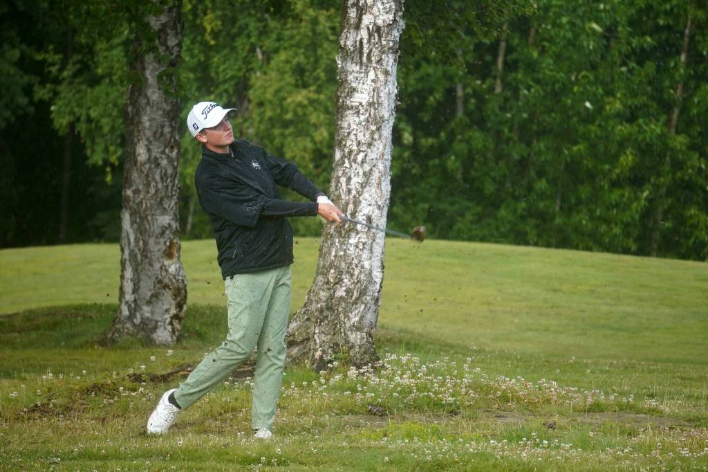 Shane Sundberg sends a golf ball flying through the rain during the Alaska Sign Source Pro Am at Birch Ridge Golf Course in Soldotna, Alaska, on Monday, July 14, 2025. (Jake Dye/Peninsula Clarion)