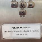 A sign on the Homer Public Librarys public phone, photographed on Saturday, July 12, 2025, notes that its the only public phone in the city of Homer, Alaska. (Delcenia Cosman/Homer News)