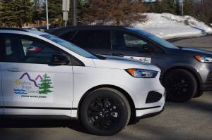 Two new cars purchased by the Soldotna Senior Center to support its Meals on Wheels program are parked outside of the center in Soldotna, Alaska, on Wednesday, March 30, 2022. (Camille Botello/Peninsula Clarion)