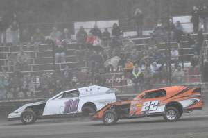 Martin Flora leads Jerry Parsons on the way to winning the Modified Dirty 30 on Saturday, July 19, 2025, at Twin City Raceway in Kenai, Alaska. (Photo by Jeff Helminiak/Peninsula Clarion)