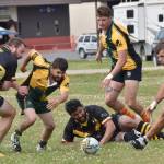 From left to right, Zach Allyn, Victor Rodriguez, Ronald Chand, Ben Richards and Connor OFarrell converge on a loose ball at the Kenai Dipnet Fest Rugby 10s Tournament at Kenais Millennium Square on Saturday, July 19, 2025. (Photo by Jeff Helminiak/Peninsula Clarion)