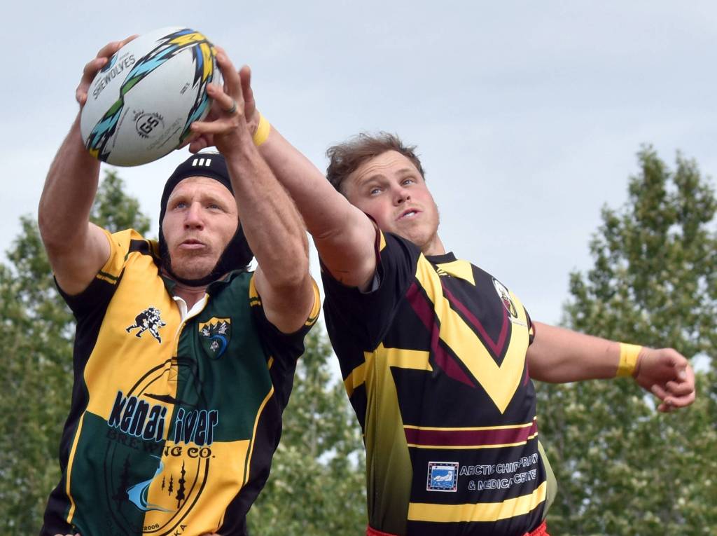 Mike Lundgren of Homer, playing for the Kenai River Wolfpack, snatches the ball from Austin Hinton of the Bird Creek Barbarians at the Kenai Dipnet Fest Rugby 10s Tournament at Kenais Millennium Square on Saturday, July 19, 2025. (Photo by Jeff Helminiak/Peninsula Clarion)