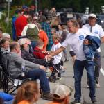 Matt Heilala, a 2026 Alaska gubernatorial candidate and 1988 Soldotna High School graduate, shakes hands during the 68th Annual Soldotna Progress Days Parade in Soldotna, Alaska, on Saturday, July 26, 2025. (Jake Dye/Peninsula Clarion)