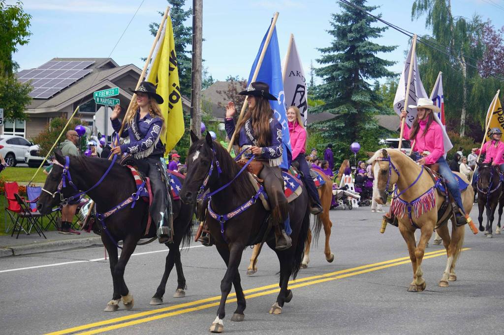 Horseriders from the Soldotna Rodeo trot up Marydale Avenue during the 68th Annual Soldotna Progress Days Parade in Soldotna, Alaska, on Saturday, July 26, 2025. (Jake Dye/Peninsula Clarion)