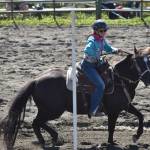 Laynee Strausbaugh competes in Open Poles at the third Soldotna Equestrian Association rodeo of the year Sunday, July 27, 2025, at the Soldotna Rodeo Grounds in Soldotna, Alaska. (Photo by Jeff Helminiak/Peninsula Clarion)