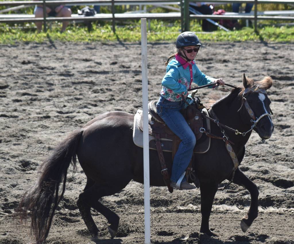 Laynee Strausbaugh competes in Open Poles at the third Soldotna Equestrian Association rodeo of the year Sunday, July 27, 2025, at the Soldotna Rodeo Grounds in Soldotna, Alaska. (Photo by Jeff Helminiak/Peninsula Clarion)