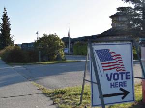 A Vote Here sign directs voters to the voting station at Homer City Hall on Oct. 3, 2023, in Homer, Alaska. (Finn Heimbold/Homer News file photo)