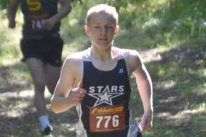 Soldotna's Ollie Dahl leads Seward's Ridge Conant at the start of the freshmen-sophomore boys race Monday, Aug. 19, 2024, at the Peninsula Class Races at Nikiski Middle-High School in Nikiski, Alaska. (Photo by Jeff Helminiak/Peninsula Clarion)