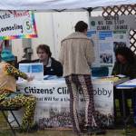 Salmonfest attendees visit booths in the Causeway, including the Citizens Climate Lobby, on Saturday, Aug. 2, 2025, at the Kenai Peninsula Fairgrounds in Ninilchik, Alaska. (Delcenia Cosman/Homer News)
