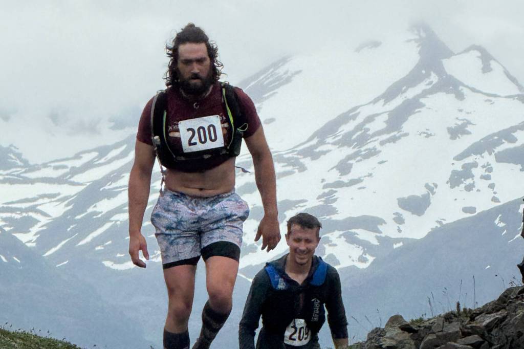 Jake Koffman treks up Grace Ridge during the 2025 Kachemak Bay Mountain Classic on Saturday, August 2, followed by Matthew Byrd. (Photo courtesy of Amy Holman)