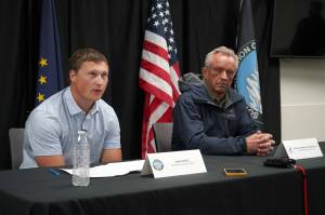 Jakob Kooly, vice chair of the Kenaitze Indian Tribes tribal council, and Robert F. Kennedy Jr., U.S. secretary of health and human services, speak during a press conference at the Denaina Wellness Center in Kenai, Alaska, on Thursday, Aug. 7, 2025. (Jake Dye/Peninsula Clarion)