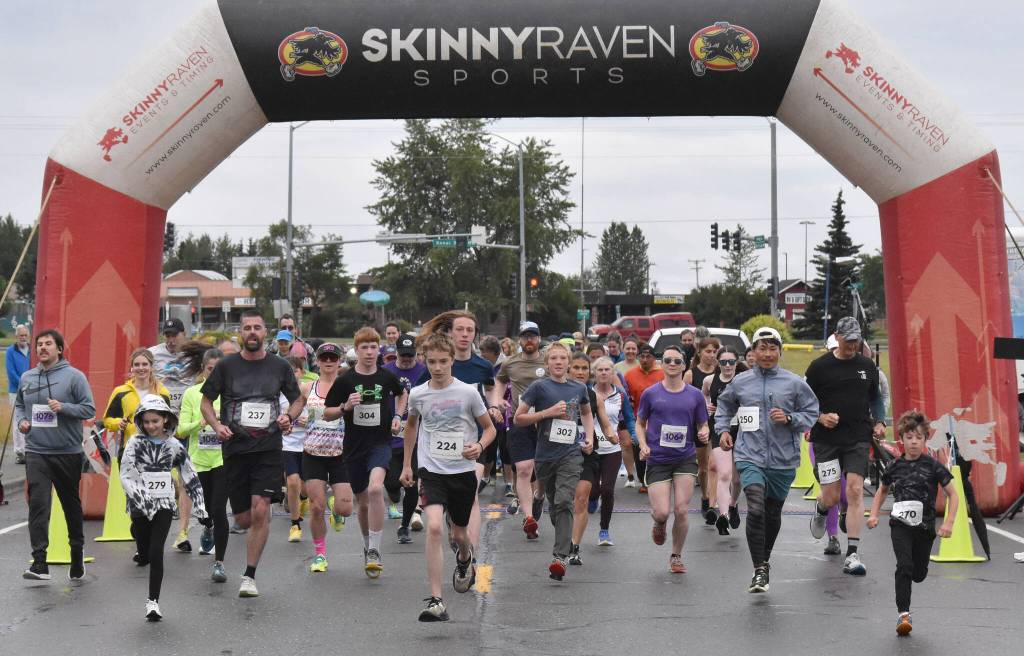Runners take off from the start of the 36th annual Violence Free Community Run on Saturday, Aug. 9, 2025, in Kenai, Alaska. (Photo by Jeff Helminiak/Peninsula Clarion)