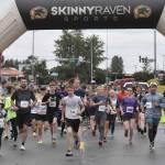 Runners take off from the start of the 36th annual Violence Free Community Run on Saturday, Aug. 9, 2025, in Kenai, Alaska. (Photo by Jeff Helminiak/Peninsula Clarion)
