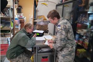 Civil Air Patrol Cadet 1st Lt. Hugh Traugott (right) works with Cadet Airman First Class Audrey Crocker (left) during a statewide training exercise on disaster response on Aug. 9-10, 2025, in Homer, Alaska.