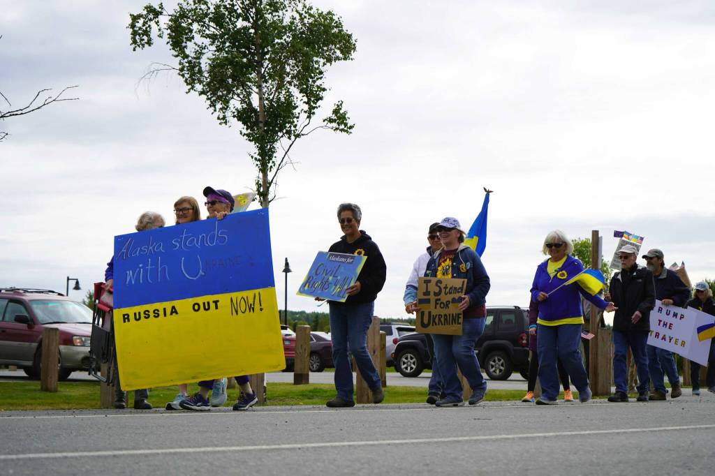 Protesters in support of Ukraine walk together from Soldotna Creek Park in Soldotna, Alaska, on Friday, Aug. 15, 2025. (Jake Dye/Peninsula Clarion)