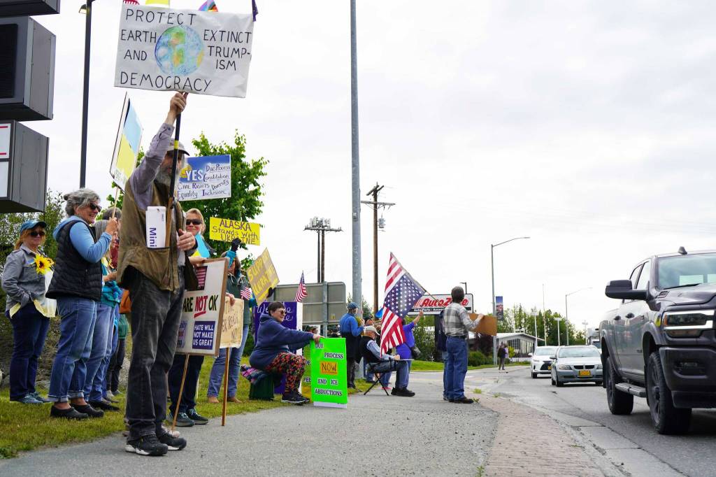 Protesters in support of Ukraine line the Sterling Highway in Soldotna, Alaska, on Friday, Aug. 15, 2025. (Jake Dye/Peninsula Clarion)