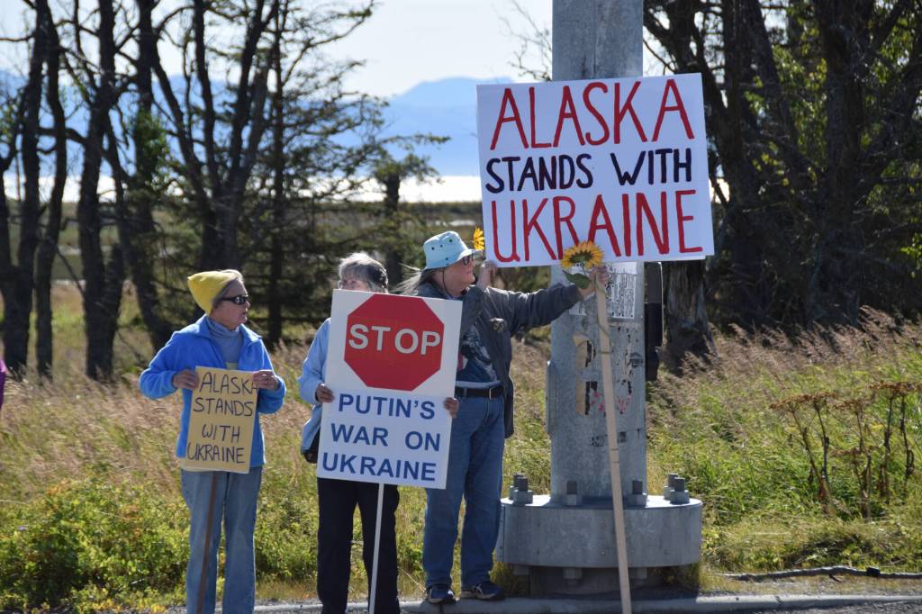 Protesters hold up signs expressing support for Ukraine and calling for a halt to Russias war on Ukraine on Friday, Aug. 15, 2025, in Homer, Alaska. (Delcenia Cosman/Homer News)