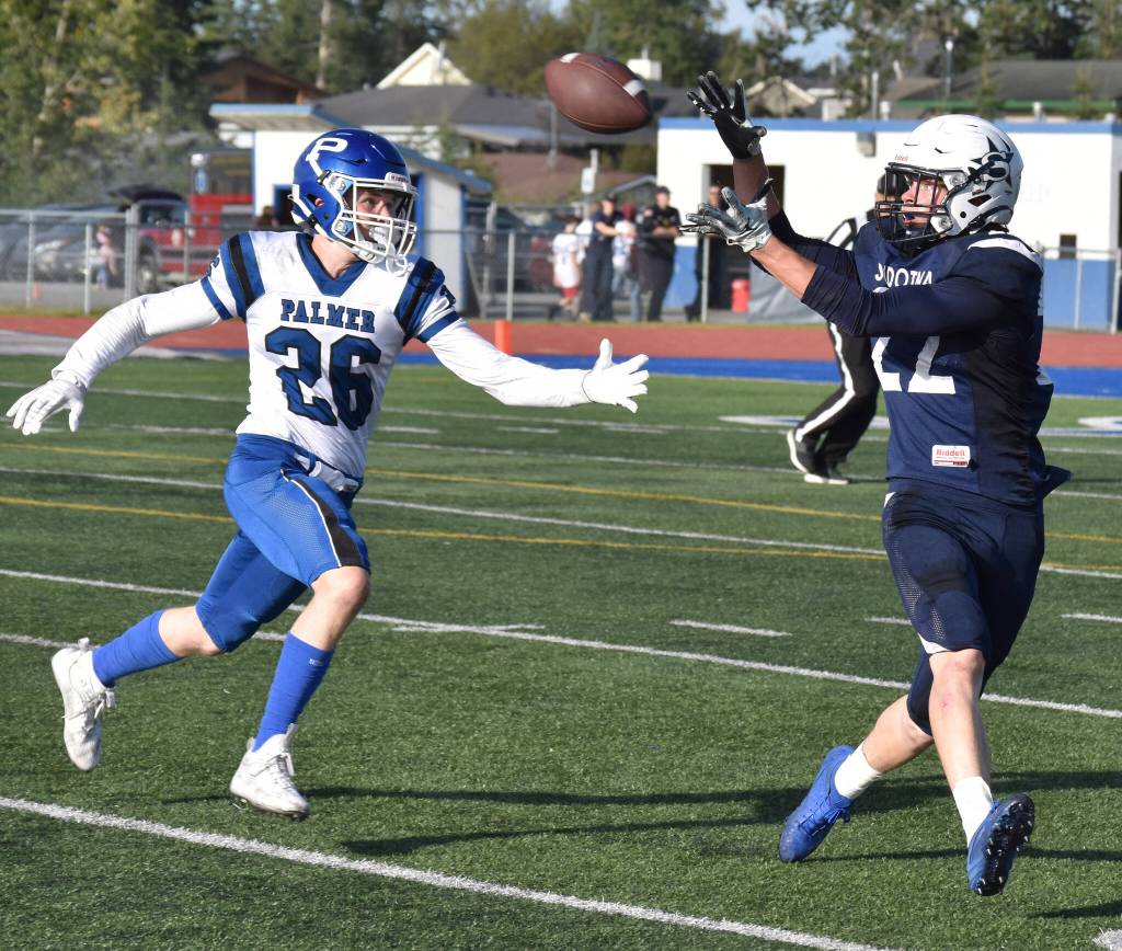 Soldotnas Matthew Schilling catches a pass in front of Palmers Lee Kirby on Friday, Aug. 15, 2025, at Justin Maile Field at Soldotna High School in Soldotna, Alaska. (Photo by Jeff Helminiak/Peninsula Clarion)
