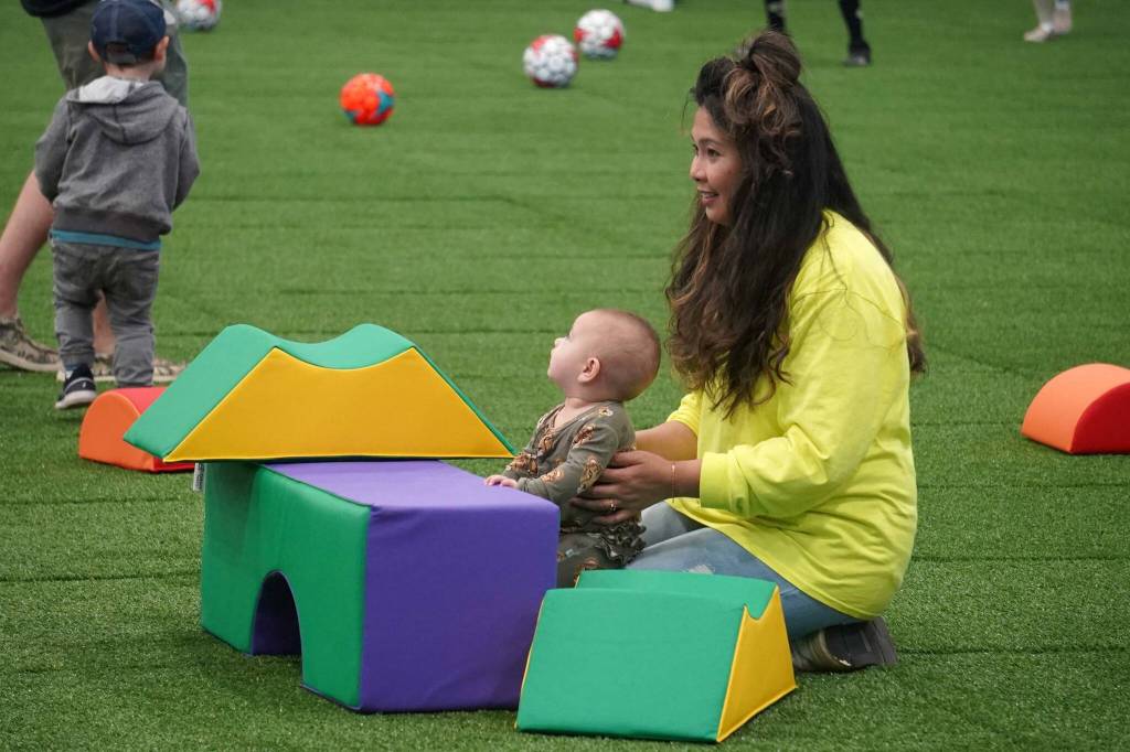 Children and families tour the Soldotna Field House during its grand opening in Soldotna, Alaska, on Saturday, Aug. 16, 2025. (Jake Dye/Peninsula Clarion)