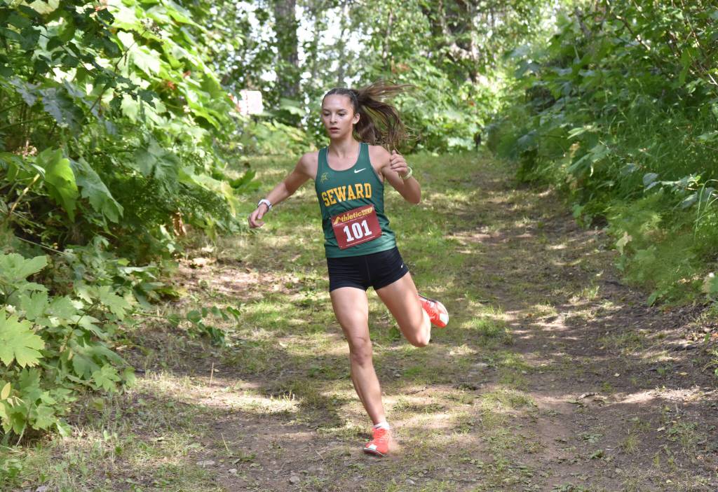 Sewards Olive Jordan runs to victory in the freshmen-sophomore girls race at the Kenai/Nikiski Class Races on Monday, Aug. 18, 2025, at Nikiski Middle-High School in Nikiski, Alaska. (Photo by Jeff Helminiak/Peninsula Clarion)