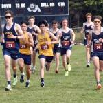 Runners start the junior-senior boys race at the Kenai/Nikiski Class Races on Monday, Aug. 18, 2025, at Nikiski Middle-High School in Nikiski, Alaska. (Photo by Jeff Helminiak/Peninsula Clarion)
