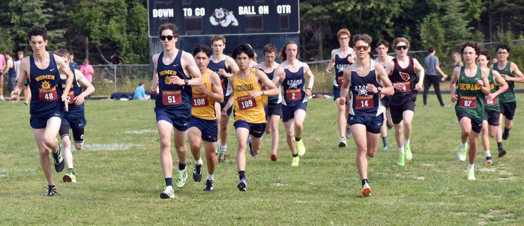 Runners start the junior-senior boys race at the Kenai/Nikiski Class Races on Monday, Aug. 18, 2025, at Nikiski Middle-High School in Nikiski, Alaska. (Photo by Jeff Helminiak/Peninsula Clarion)