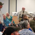 Former Alaska House Rep. Ben Carpenter and Ray Southwell rise in support of speaker David Haeg during a town hall on the Alaska grand jury process in the Betty J. Glick Assembly Chambers in Soldotna, Alaska, on Monday, Aug. 18, 2025. (Jake Dye/Peninsula Clarion)