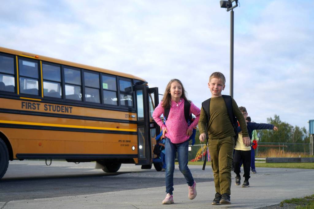 Students exit the school bus on the first day of the 2025-2026 school year at Nikiski North Star Elementary School in Nikiski, Alaska, on Wednesday, Aug. 20, 2025. (Jake Dye/Peninsula Clarion)