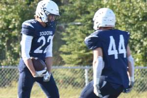 Soldotna's Matthew Schilling celebrates his touchdown with Logan Myers on Friday, Aug. 22, 2025, at Justin Maile Field at Soldotna High School in Soldotna, Alaska. (Photo by Jeff Helminiak/Peninsula Clarion)