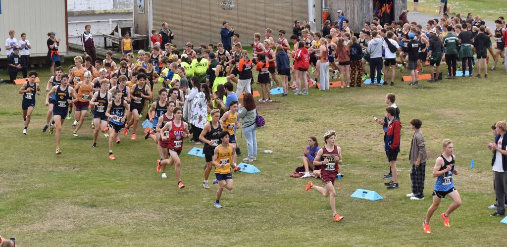 Chugiaks Dausen Loughman leads at the start of the boys varsity race at the Ted McKenney XC Invitational on Saturday, Aug. 23, 2025, at Tsalteshi Trails just outside of Soldotna, Alaska. (Photo by Jeff Helminiak/Peninsula Clarion)