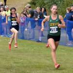 Sewards Olive Jordan holds off Homers Ariela Garvey at the finish of the girls varsity race at the Ted McKenney XC Invitational on Saturday, Aug. 23, 2025, at Tsalteshi Trails just outside of Soldotna, Alaska. (Photo by Jeff Helminiak/Peninsula Clarion)