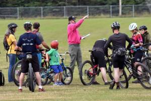 Mark Beeson gives instructions before The Gauntlet on Sunday, Aug. 24, 2025, at Tsalteshi Trails just outside of Soldotna, Alaska. (Photo by Jeff Helminiak/Peninsula Clarion)