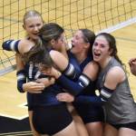 Soldotnas Rebekah Pieh (17) is mobbed by Cassidy Kruse, Teagen Kobylarz and Grayson Henry after a match-winning block Tuesday, Aug. 26, 2025, at Nikiski Middle-High School in Nikiski, Alaska. (Photo by Jeff Helminiak/Peninsula Clarion)