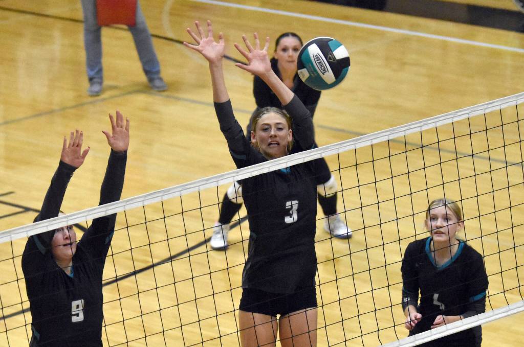 Nikiskis Emma OBrien and Blakeley Jorgensen put up a block against Soldotna on Tuesday, Aug. 26, 2025, at Nikiski Middle-High School in Nikiski, Alaska. (Photo by Jeff Helminiak/Peninsula Clarion)