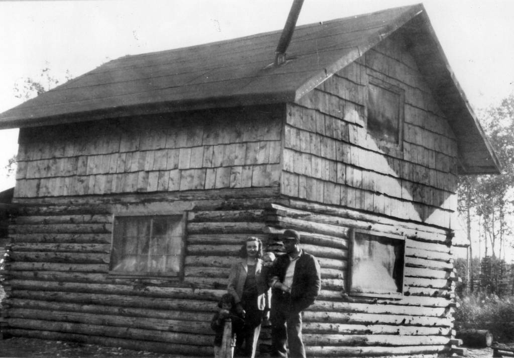 Howard and Maxine Lee, with their two children, pose behind their newly completed home in Soldotna in 1950. This structure, which became Soldotnas first post office, stood on part of the homestead that contained a large gravel pit that is now home to the Kenai Peninsula Boroughs administration building. (Photo Soldotna Historical Society)