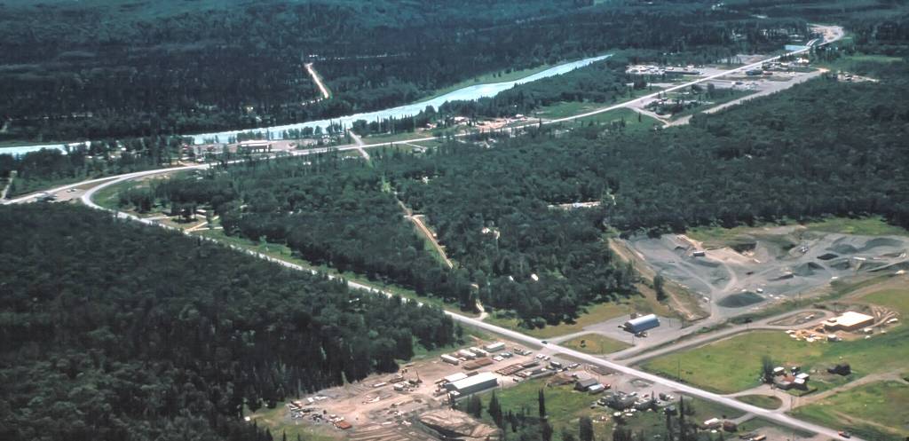 This 1960 aerial Soldotna shows the scar formed by the Soldotna Gravel Pit, where the Borough Administration Building now stands. Other interesting notes: To the left of the gravel pit is a large Quonset hut, which at this time was the Soldotna Theatre. In the lower right corner of the photo are Soldotna Elementary Schools first four classes under construction  the school would open to students in the fall  and, nearby, the barn that once comprised part of Joe Faas corral, for which Corral Street was later named. (Photo courtesy of Al Hershberger)