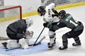 Minnesota Wilderness goalie Adam Prokop stops Andy Larson of the Kenai River Brown Bears in front of Nolan Bettens of the Wilderness on Friday, Oct. 13, 2023, at the Soldotna Regional Sports Complex in Soldotna, Alaska. (Photo by Jeff Helminiak/Peninsula Clarion)