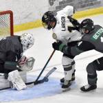 Minnesota Wilderness goalie Adam Prokop stops Andy Larson of the Kenai River Brown Bears in front of Nolan Bettens of the Wilderness on Friday, Oct. 13, 2023, at the Soldotna Regional Sports Complex in Soldotna, Alaska. (Photo by Jeff Helminiak/Peninsula Clarion)