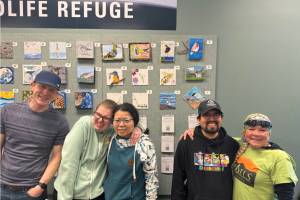 Artists in the Homer Independent Living Center's Artability program are photographed with their artwork on display at the Alaska Maritime National Wildlife Refuge during the 2025 Shorebird Festival in Homer, Alaska. Photo provided by the Independent Living Center