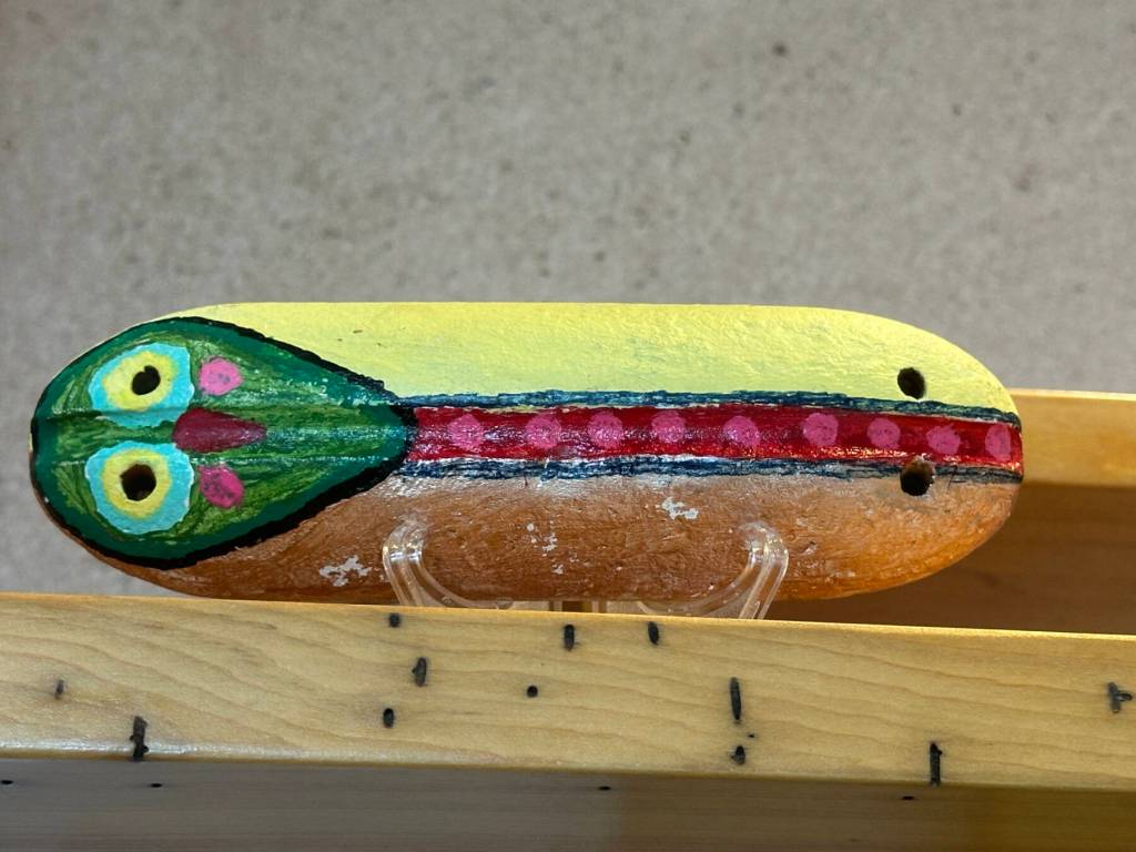 A painted buoy on display through September in the Homer Public Librarys Fireplace Reading Lounge is one of numerous pieces by participants in the Independent Living Centers Artability program in Homer, Alaska. Photo by Christina Whiting