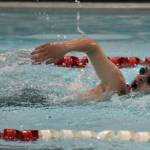 Homers Robert Frost competes in the 100-yard freestyle Friday, Aug. 29, 2025, at Kenai Central High School in Kenai, Alaska. (Photo by Jeff Helminiak/Peninsula Clarion)
