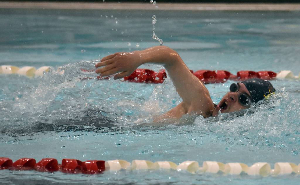 Homers Robert Frost competes in the 100-yard freestyle Friday, Aug. 29, 2025, at Kenai Central High School in Kenai, Alaska. (Photo by Jeff Helminiak/Peninsula Clarion)