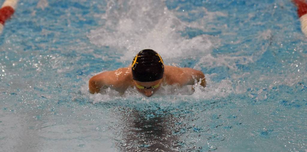 Homers Jeremiah Overdorf competes in the 100-yard butterfly Friday, Aug. 29, 2025, at Kenai Central High School in Kenai, Alaska. (Photo by Jeff Helminiak/Peninsula Clarion)