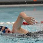 Homers Elayna Wilson competes in the 100-yard freestyle Friday, Aug. 29, 2025, at Kenai Central High School in Kenai, Alaska. (Photo by Jeff Helminiak/Peninsula Clarion)