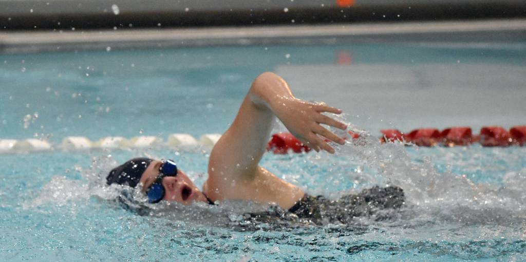 Homers Elayna Wilson competes in the 100-yard freestyle Friday, Aug. 29, 2025, at Kenai Central High School in Kenai, Alaska. (Photo by Jeff Helminiak/Peninsula Clarion)