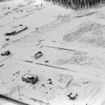This April 1961 aerial of Soldotna shows  in the upper left  the gravel pit where the Kenai Peninsula Boroughs administration building would be constructed a decade later. The faint road running diagonally from the upper left would later become Binkley Street. The rectangular building in the lower middle portion of the image is the central peninsulas first medical-dental clinic. (Photo courtesy of the Fair Family Collection)