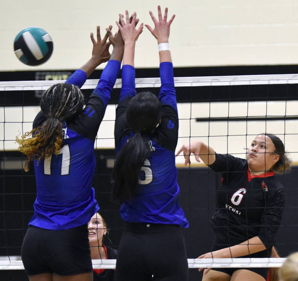Kenai Centrals Bryleigh Williams attacks against Palmers Leila Petersen and Rainee Reiter on Saturday, Sept. 6, 2025, at the 18th annual Shayna Pritchard Memorial Volleyball Tournament at Nikiski Middle-High School in Nikiski, Alaska. (Photo by Jeff Helminiak/Peninsula Clarion)